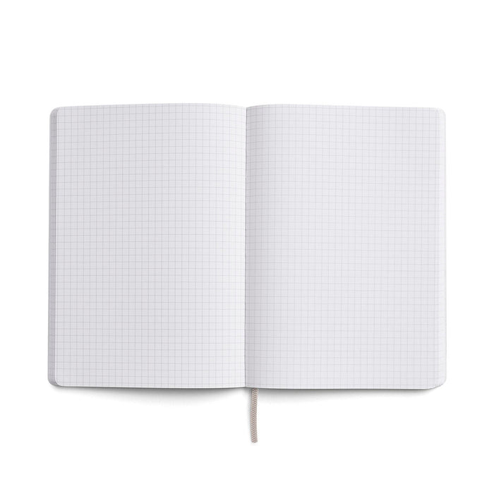 Open Karst A5 notebook with grid pages made from eco-friendly stone paper, ideal for note-taking, sketching, and journaling.