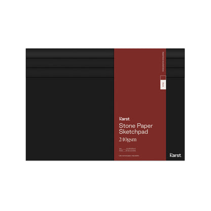Karst Stone Paper Sketchpad with a black cover and burgundy wrap label, featuring 240gsm pages, shown closed on a white background.