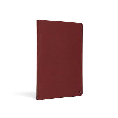Karst A5 Stone Paper Notebook with burgundy red hard cover, eco-friendly waterproof notebook for journaling, planning, note-taking, and everyday productivity.