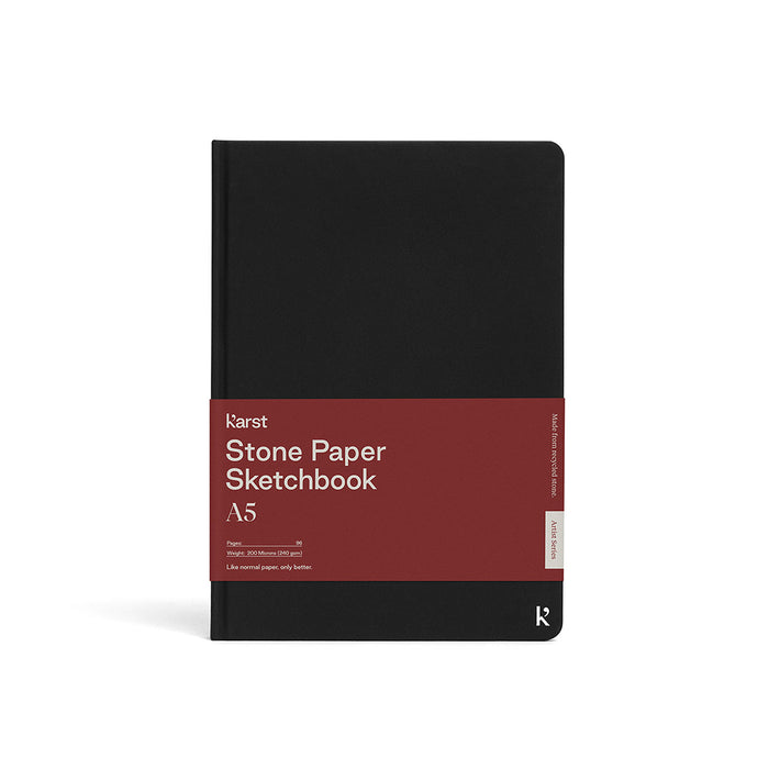 Karst A5 Stone Paper Sketchbook with black hardcover, eco-friendly stone paper sketch pad for drawing, sketching, illustration, and artist supplies.