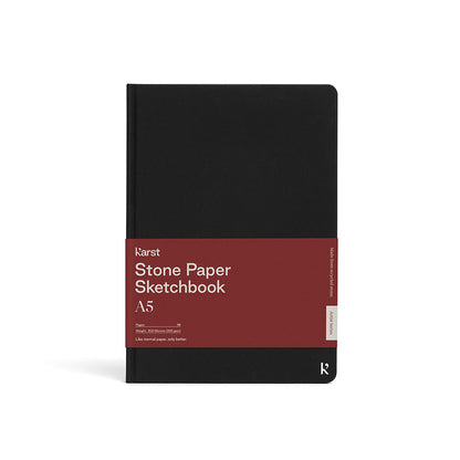 Karst A5 Stone Paper Sketchbook with black hardcover, eco-friendly stone paper sketch pad for drawing, sketching, illustration, and artist supplies.