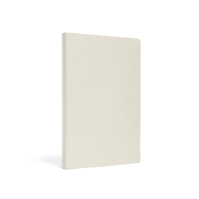 Karst A5 hardcover notebook in light beige with minimalist design and eco-friendly stone paper pages for writing and journaling.