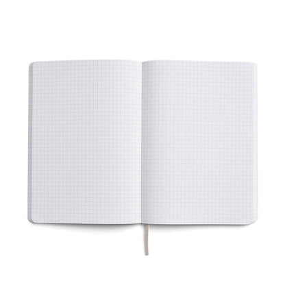Open Karst A5 notebook with grid pages made from eco-friendly stone paper, ideal for note-taking, sketching, and journaling.