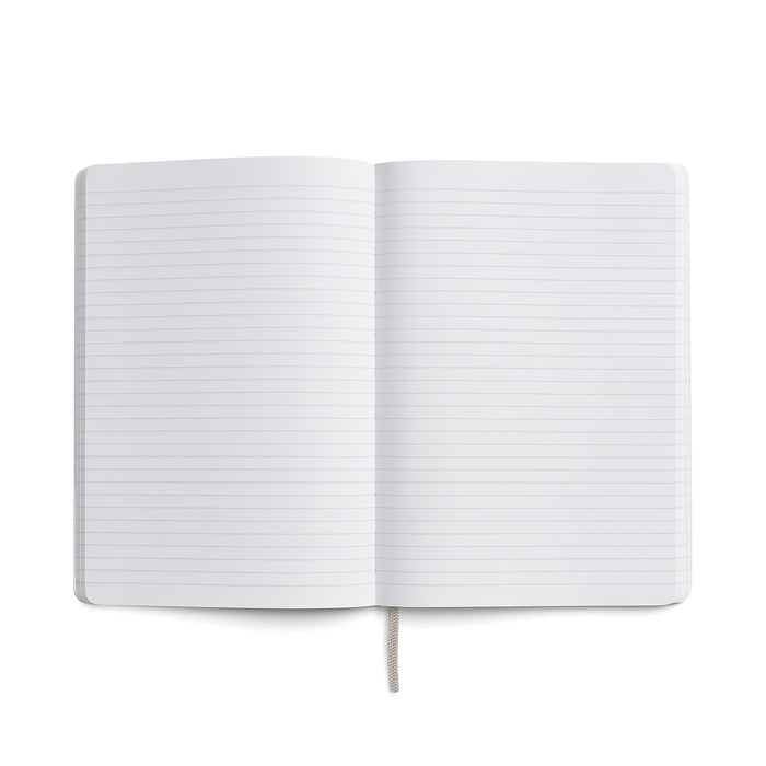 Open Karst Stone Paper Notebook showing two blank lined pages laid flat, with a light grey ribbon bookmark visible at the bottom, on a white background.