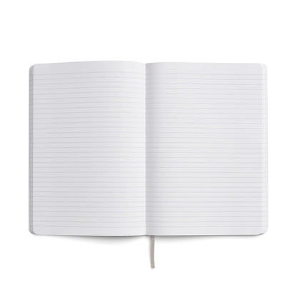 Open Karst Stone Paper Notebook showing two blank lined pages laid flat, with a light grey ribbon bookmark visible at the bottom, on a white background.
