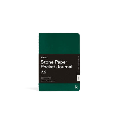 Green pocket journal with text on a white background