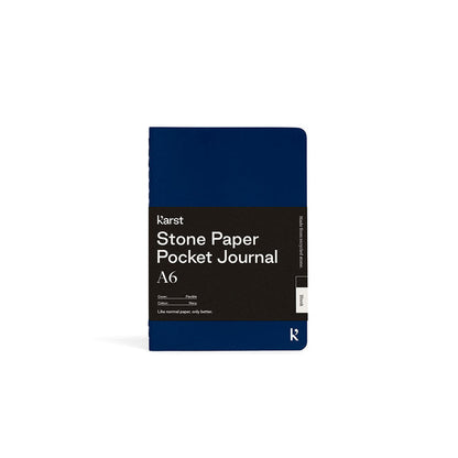 Blue pocket journal with text on a white background