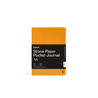 Yellow pocket journal with black label on a white background