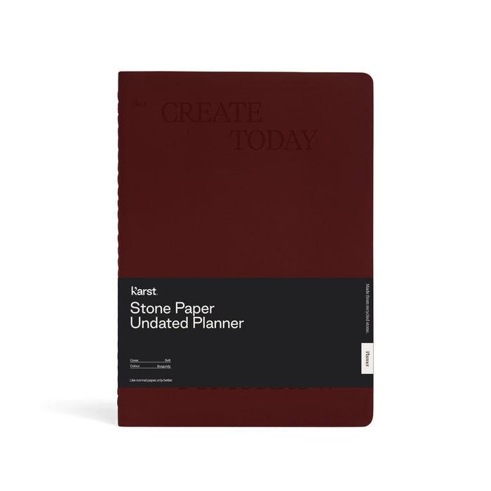 Front view of a burgundy Karst Stone Paper Undated Planner notebook with the phrase “Create Today” embossed on the cover and a black product band labeled “Stone Paper Undated Planner,” displayed against a white background.