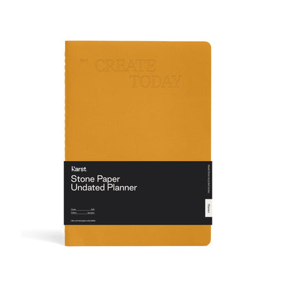 Karst Stone Paper Undated Planner notebook in turmeric yellow with “Create Today” embossed cover and black product band, eco-friendly stone paper planner for journaling and organization.