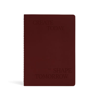 Karst Stone Paper Undated Planner in burgundy with embossed “Create Today, Shape Tomorrow” text on minimalist hardcover notebook.