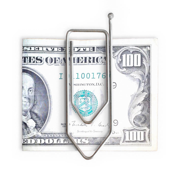 Stainless steel wire money clip puzzle holding a US 100 dollar bill, minimalist metal brain teaser that doubles as a clever money holder gift.