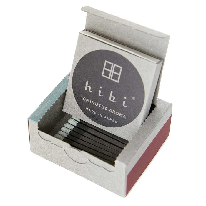 Open hibi 10 Minutes Aroma incense matchbox displaying black incense matches inside the packaging on a white background.