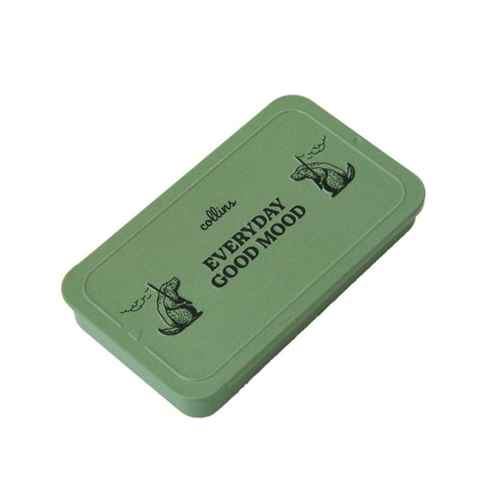 Muted green Collins Everyday Good Mood incense tin with playful illustrated graphics, compact minimalist storage case for modern home fragrance and incense accessories.