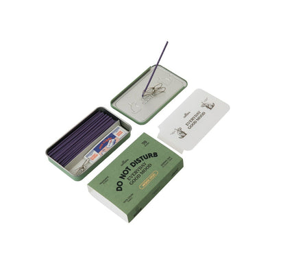 Collins Everyday Good Mood incense set labeled “Do Not Disturb,” shown open with purple incense sticks, metal clip holder, tray lid, and muted green packaging on a clean white background.