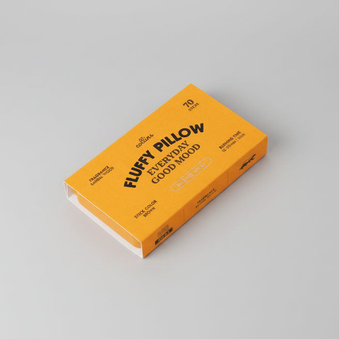 Warm yellow Collins Everyday Good Mood incense box labeled “Fluffy Pillow,” sandalwood-scented incense sticks in bold modern packaging on a clean white background.
