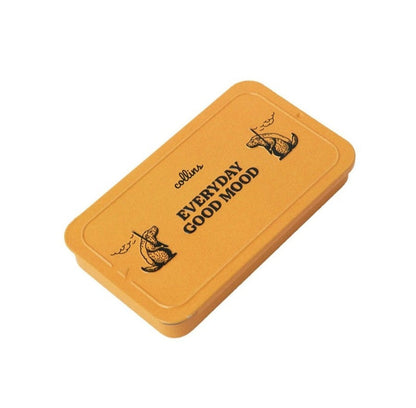 Warm yellow Collins Everyday Good Mood incense tin with playful illustrated graphics, compact minimalist storage case for modern home fragrance and incense accessories.