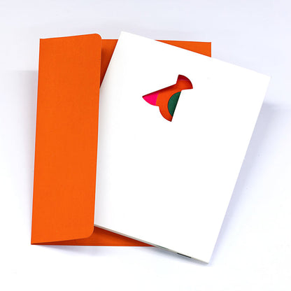 Minimalist greeting card with a flower-shaped cutout on a white cover, paired with a bright orange envelope in a clean modern stationery presentation.