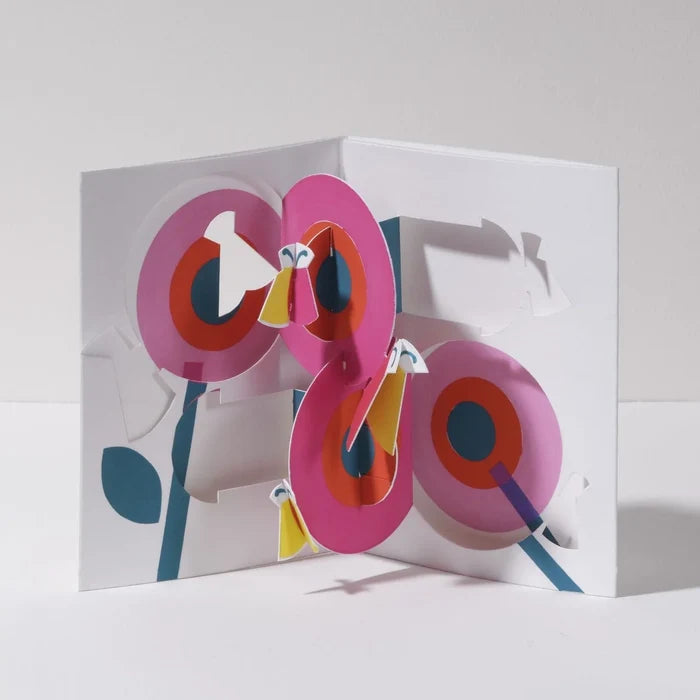 Open 3D pop-up greeting card featuring bright pink flowers with colorful butterflies in a bold modern paper art design, perfect for birthdays, spring celebrations, and special occasions.
