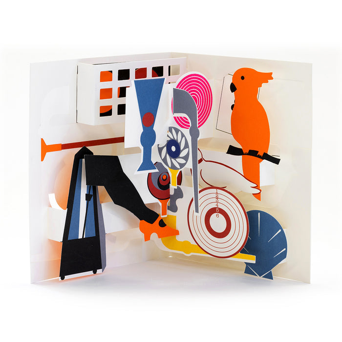 Colorful 3D pop-up greeting card with modern paper illustrations including a bright orange parrot, geometric shapes, glasses, a shell, and abstract objects in an artistic contemporary design.