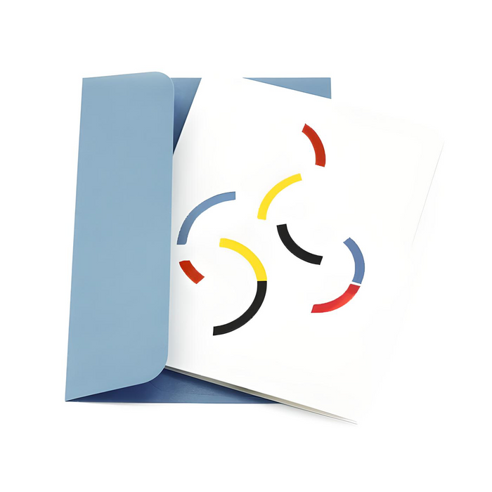 Minimalist greeting card with colorful abstract curved shapes on a white cover, paired with a soft blue envelope in a clean modern stationery presentation.