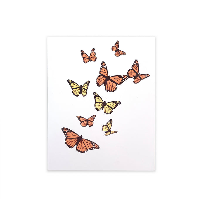 Greeting card with illustrated orange and yellow monarch butterflies in flight on a white cover, elegant nature-inspired stationery for birthdays, celebrations, and special occasions.