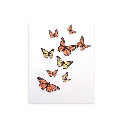 Greeting card with illustrated orange and yellow monarch butterflies in flight on a white cover, elegant nature-inspired stationery for birthdays, celebrations, and special occasions.