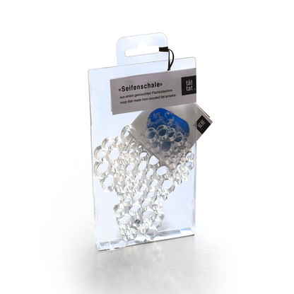 Clear geometric soap dish in retail packaging, minimalist bathroom accessory made from recycled flat screens, designed to keep bar soap dry and elevate modern sink organization.