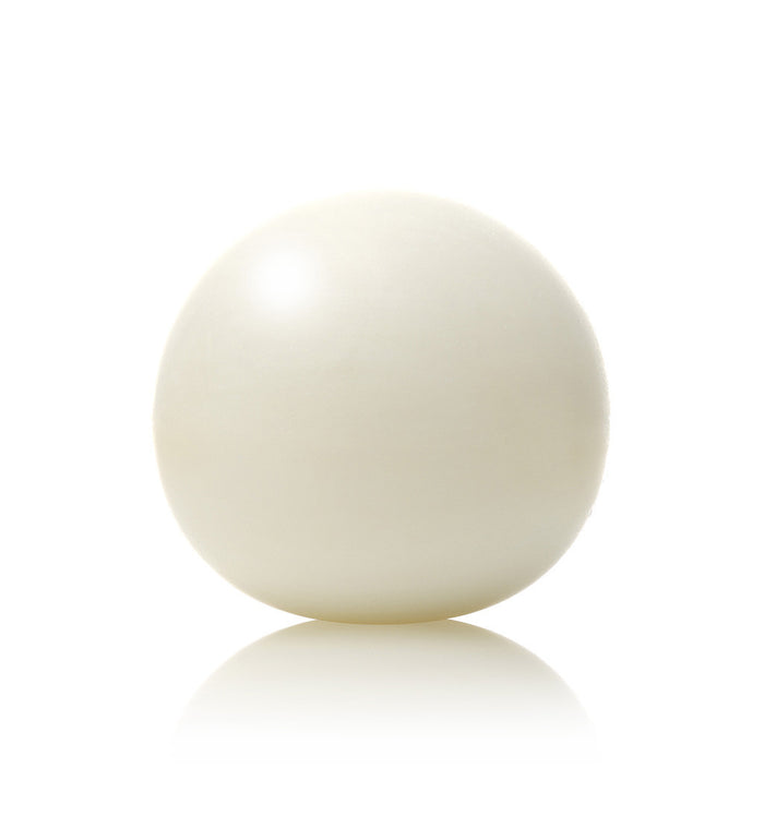 Minimalist white spherical soap bar with smooth matte finish, modern round soap for contemporary bathroom and skincare routines.