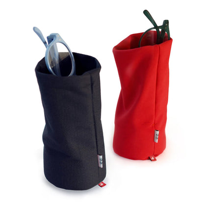 Two soft desk organizers in navy blue and red used as eyeglass holders, modern multifunctional fabric containers for glasses, pens, or office accessories.