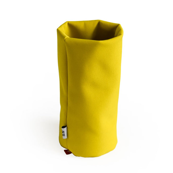 Yellow soft fabric desk organizer, minimalist multifunctional holder for glasses, pens, or office accessories, modern soft storage container for desk organization.