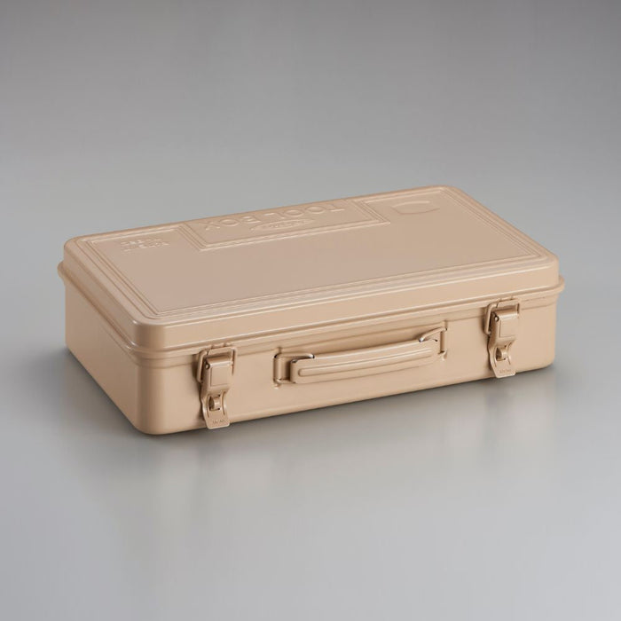 Beige Toyo steel toolbox with handle and dual metal latches, shown closed on a neutral background.