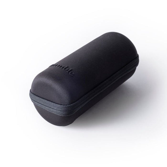 A black travel case with a zipper, possibly made of hard plastic or metal, with the brand name visible on the top