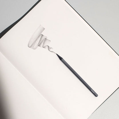 Karst woodless graphite pencil sketching smooth shading on stone paper notebook, premium solid graphite drawing pencil for shading, sketching, and artist illustration.